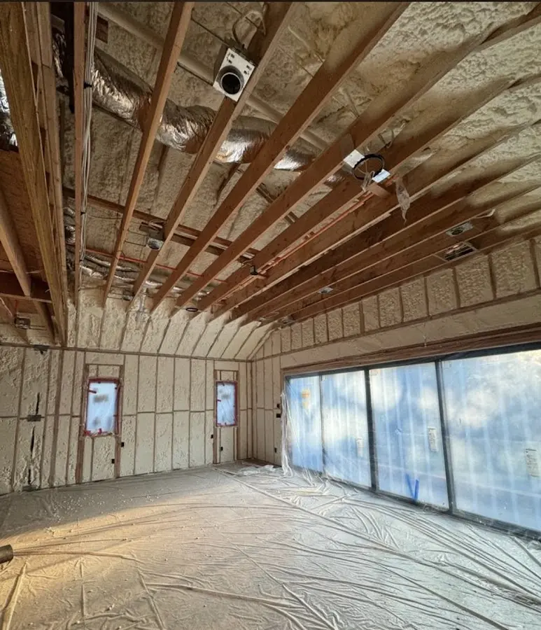 Interior walls and ceiling insulated with spray foam during new construction in Wheeling